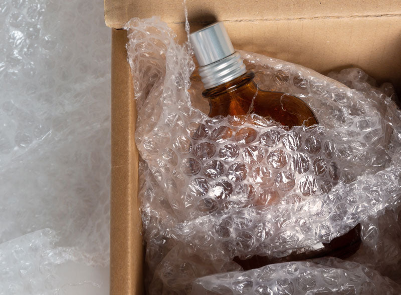 Budget Perfume in a delivery box with bubble wrap